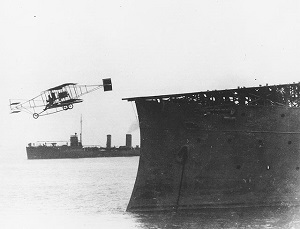 Eugene Ely makes the first airplane takeoff from a warship