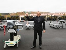 Azerbaijani President Ilham Aliyev poses with Israeli-made IAI Harop and SkyStriker loitering munitions. These munitions destroyed at least 74 Armenian armoured fighting vehicles during the Nagorno-Karabakh War